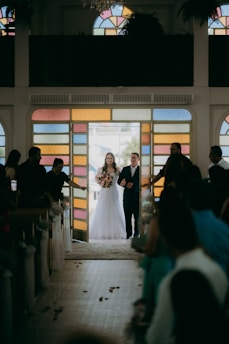 A bride walks down the aisle during her wedding.