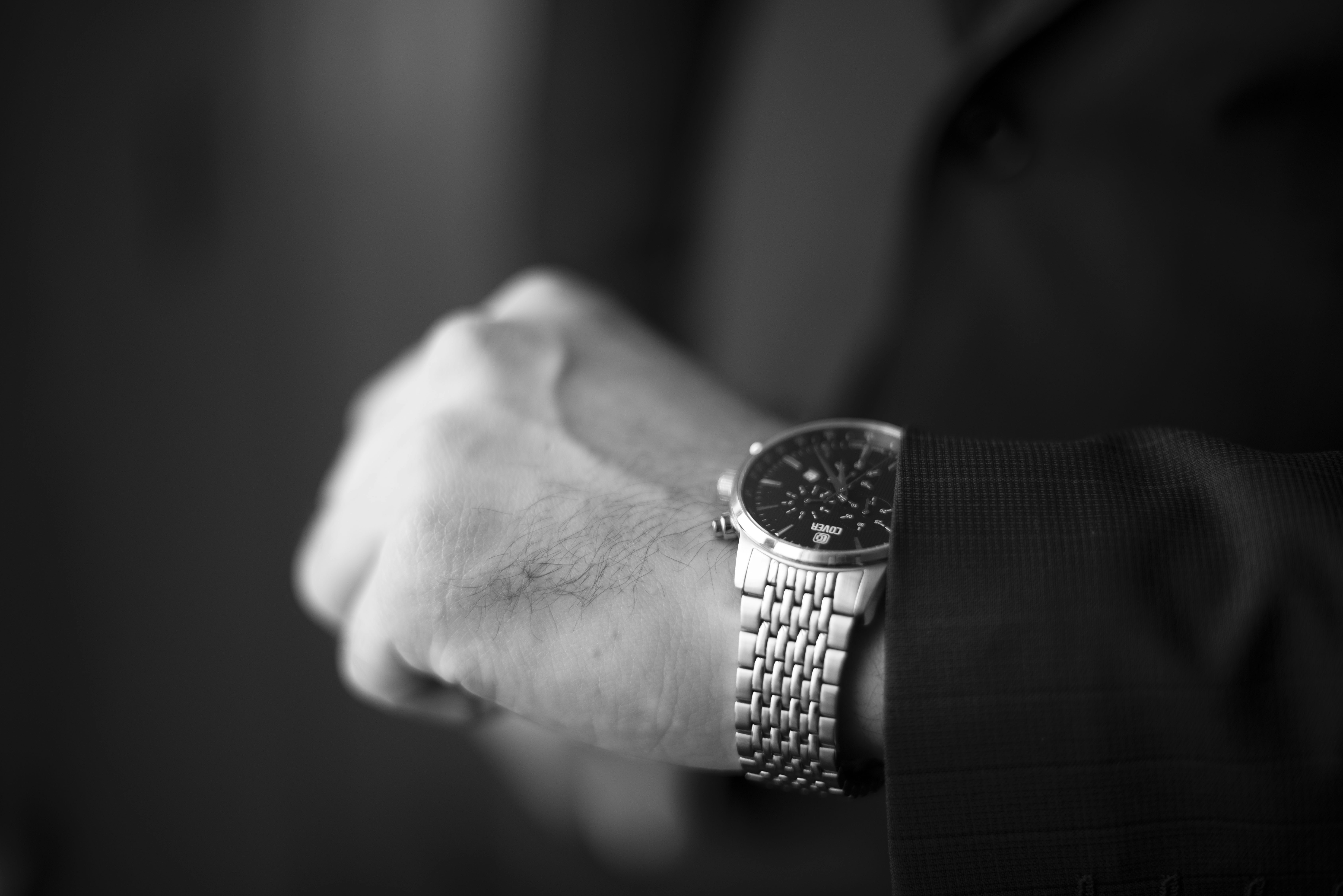 Checking the time with a stylish wristwatch.