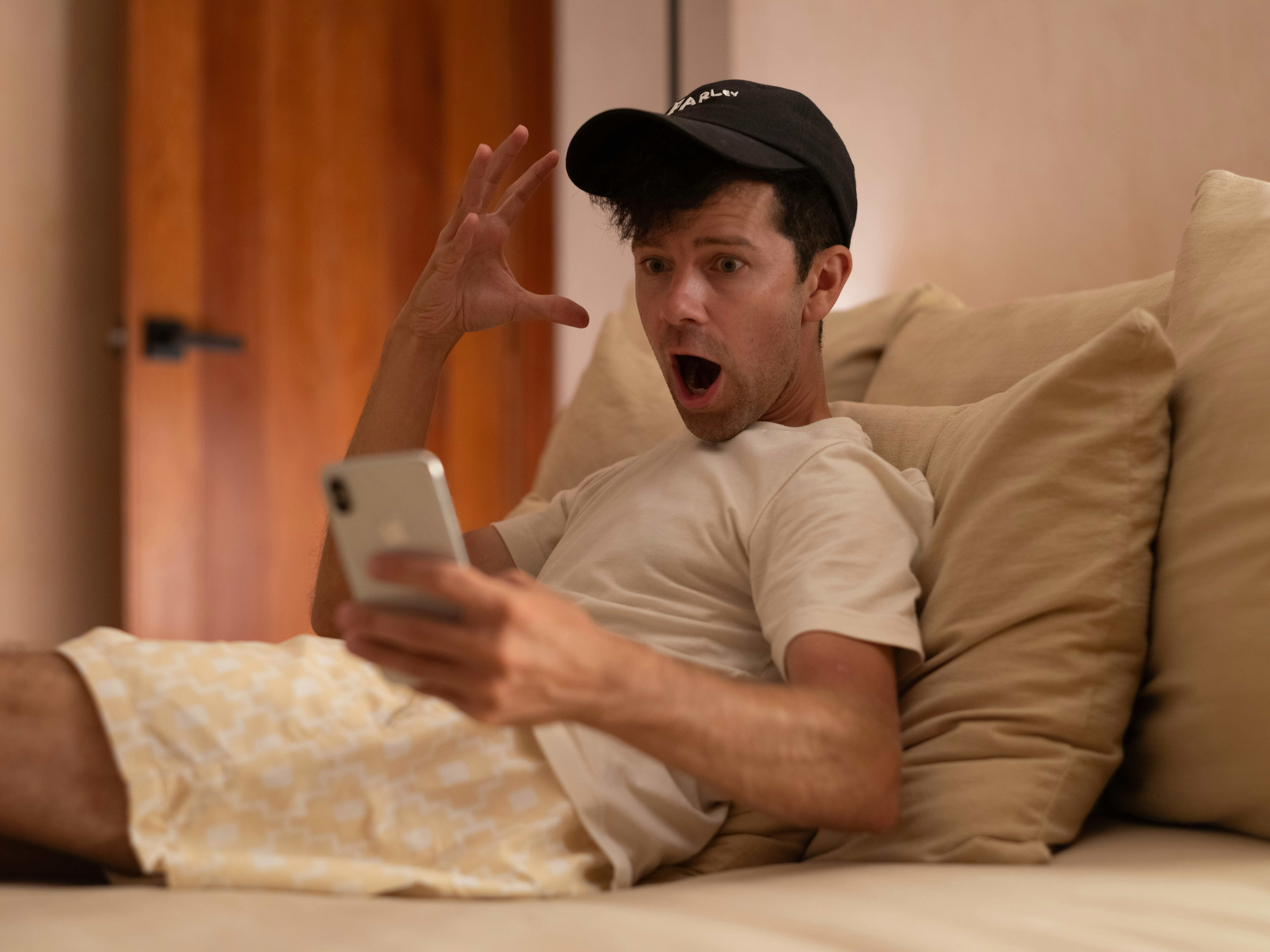 frustrated resident on the phone contrasted with a happy resident receiving a notification on their device - HOA communication tools