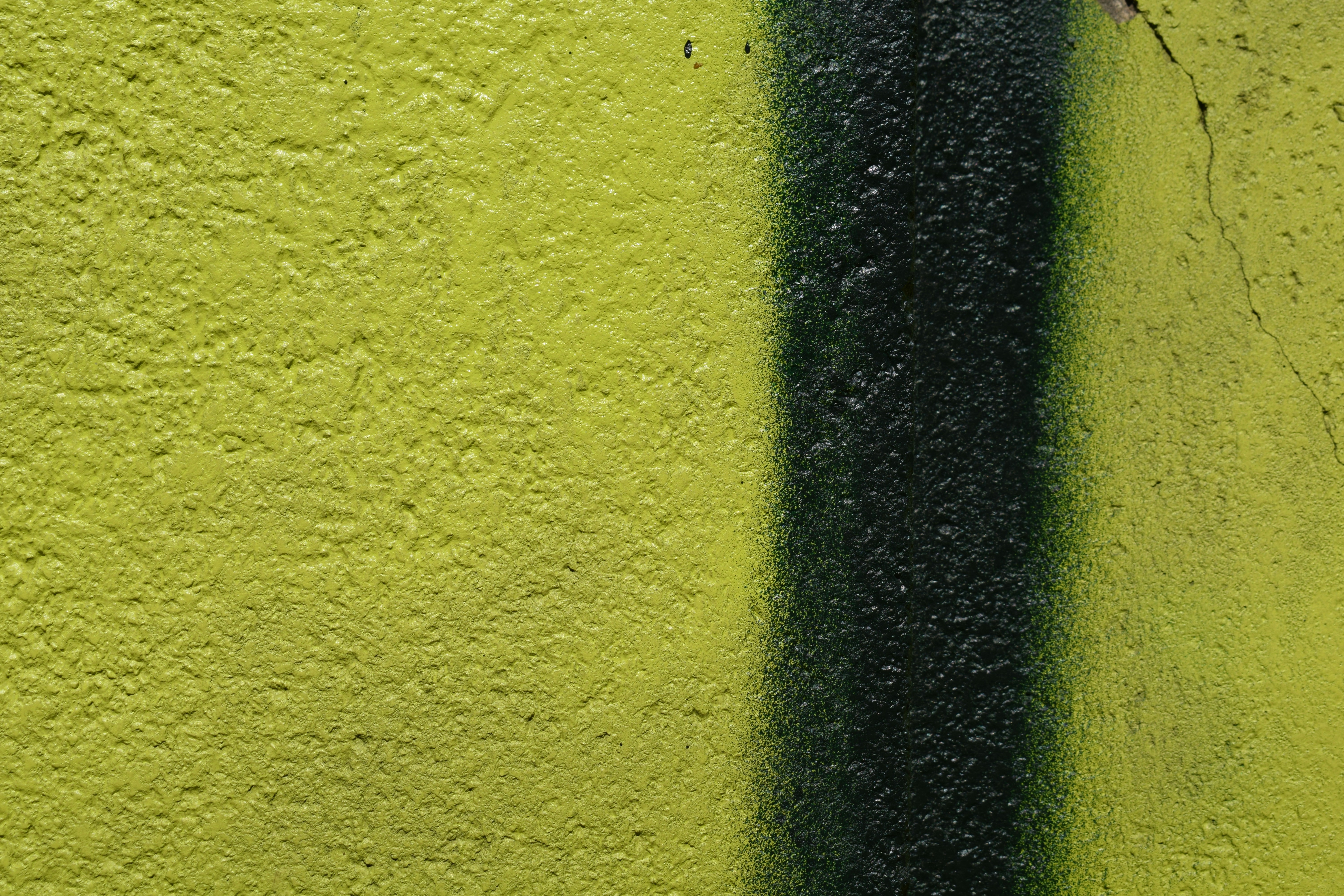 Yellow wall with a black vertical stripe.