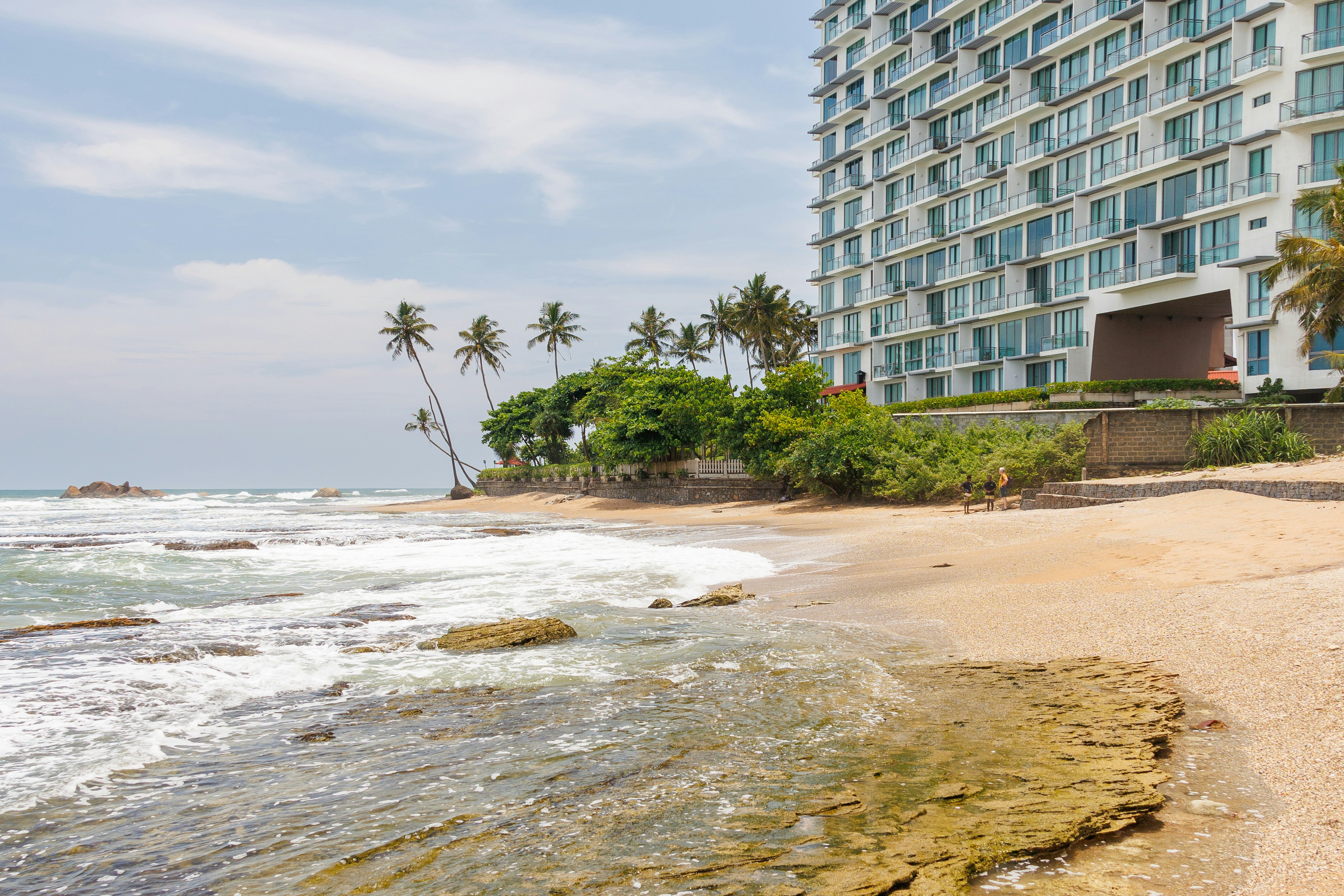 A beach front property, ocean view and building., 