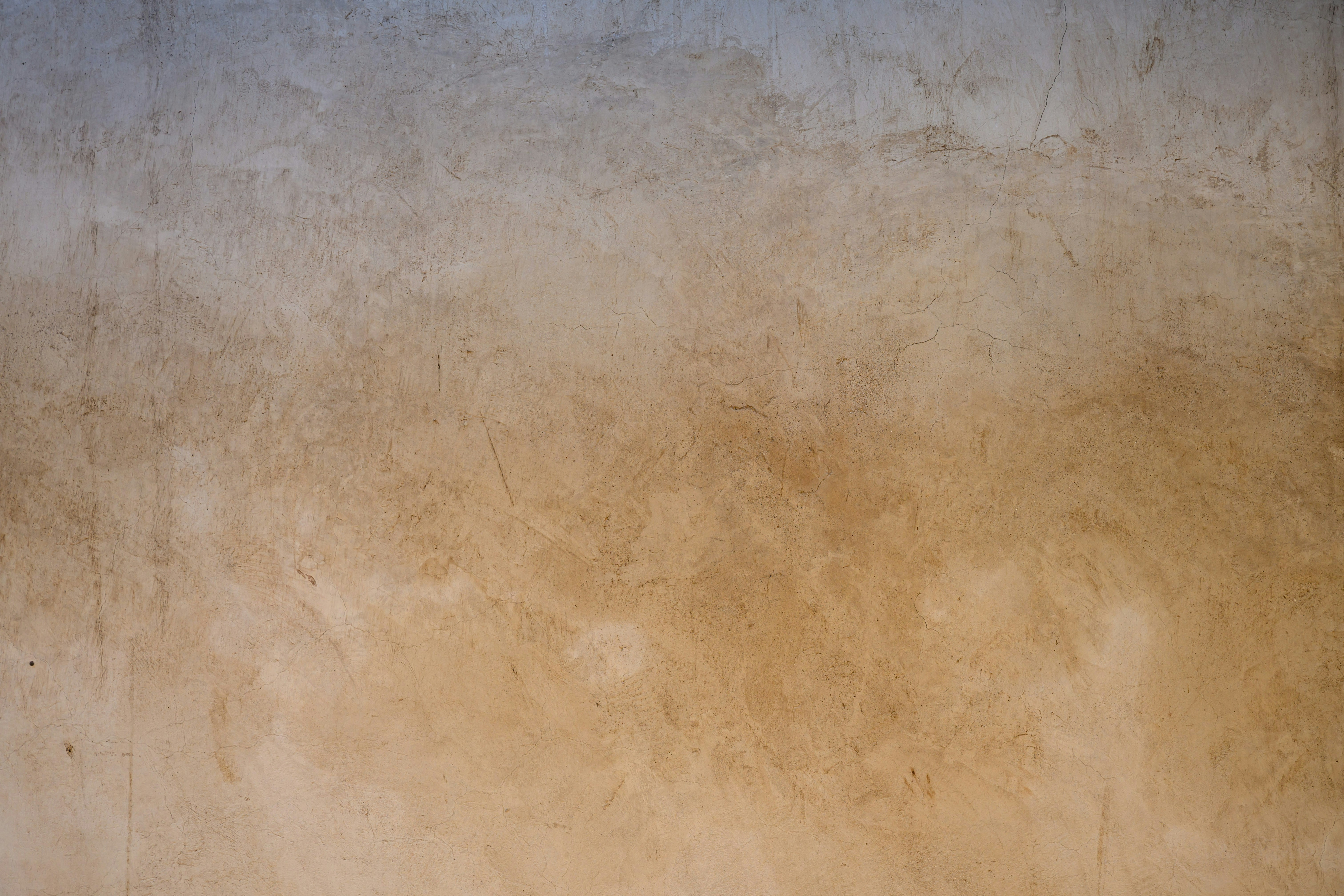 An abstract background features shades of brown and tan.