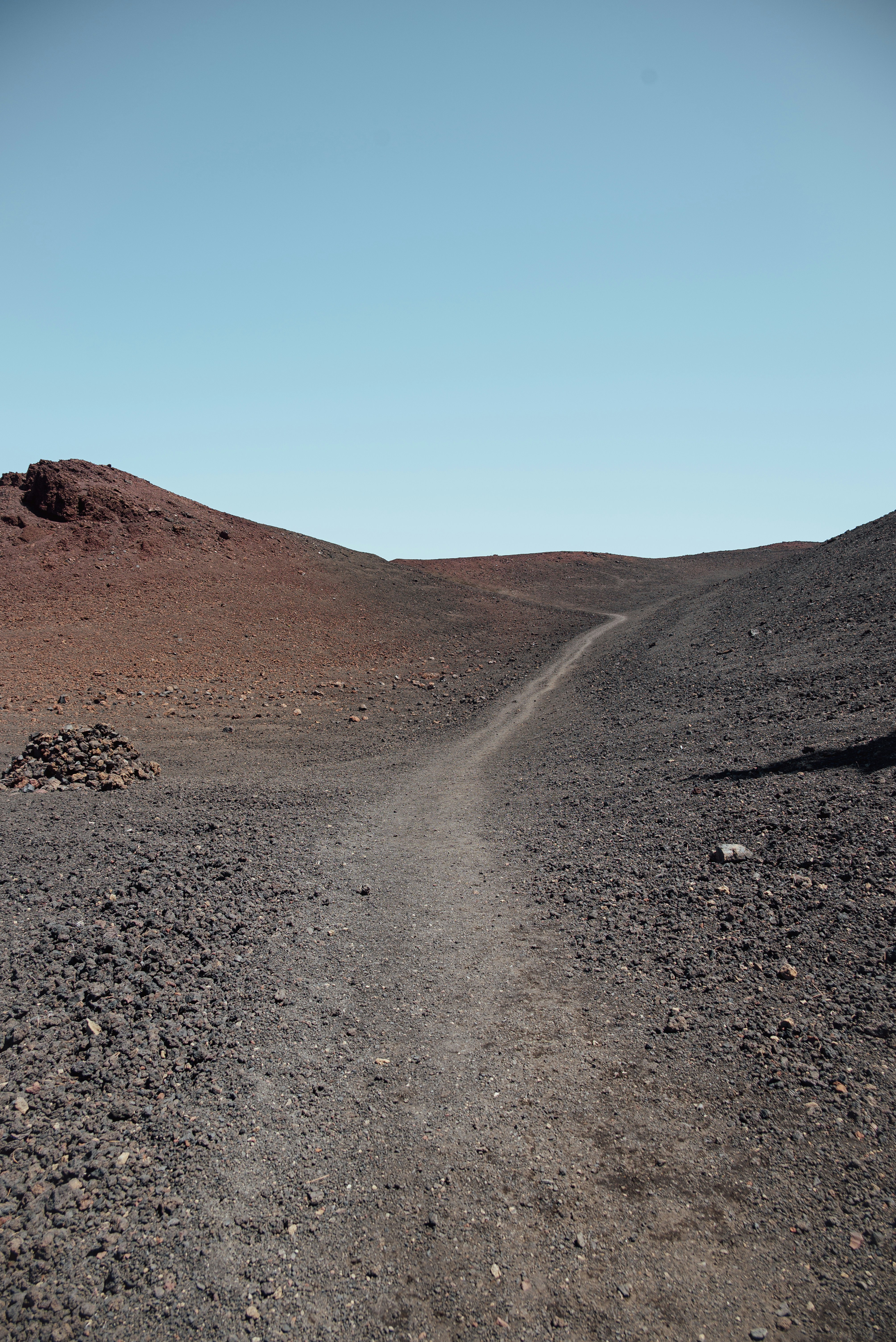 A path winds through a desolate landscape.