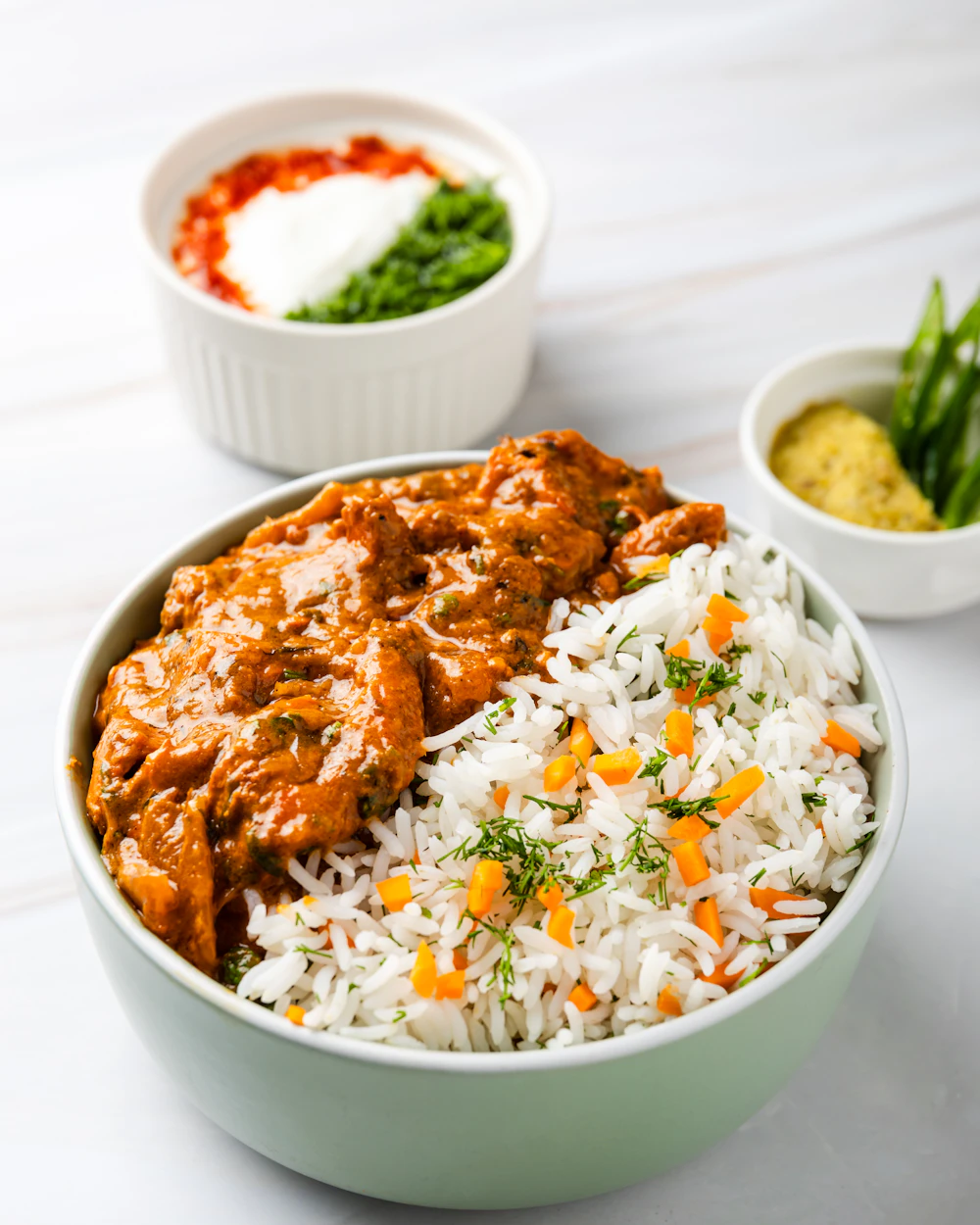 Butter chicken served with rice, the signature dish at Spice Route Kitchen