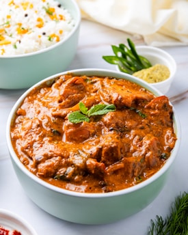 Delicious indian chicken curry and rice, ready to eat.