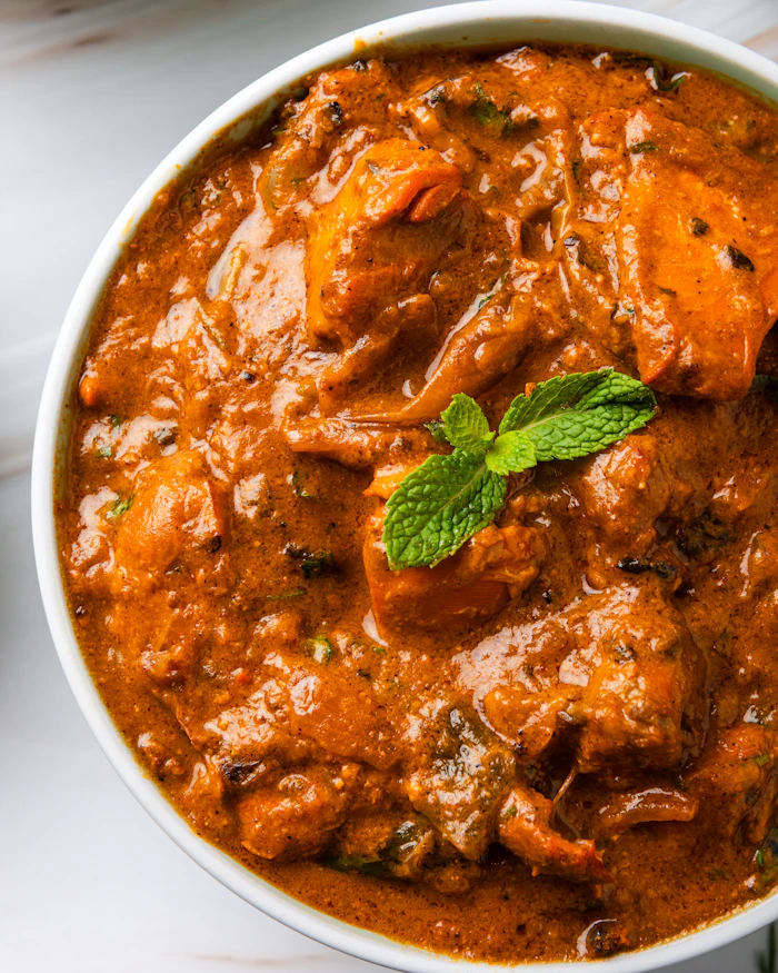 Chicken tikka masala in a rich creamy tomato curry