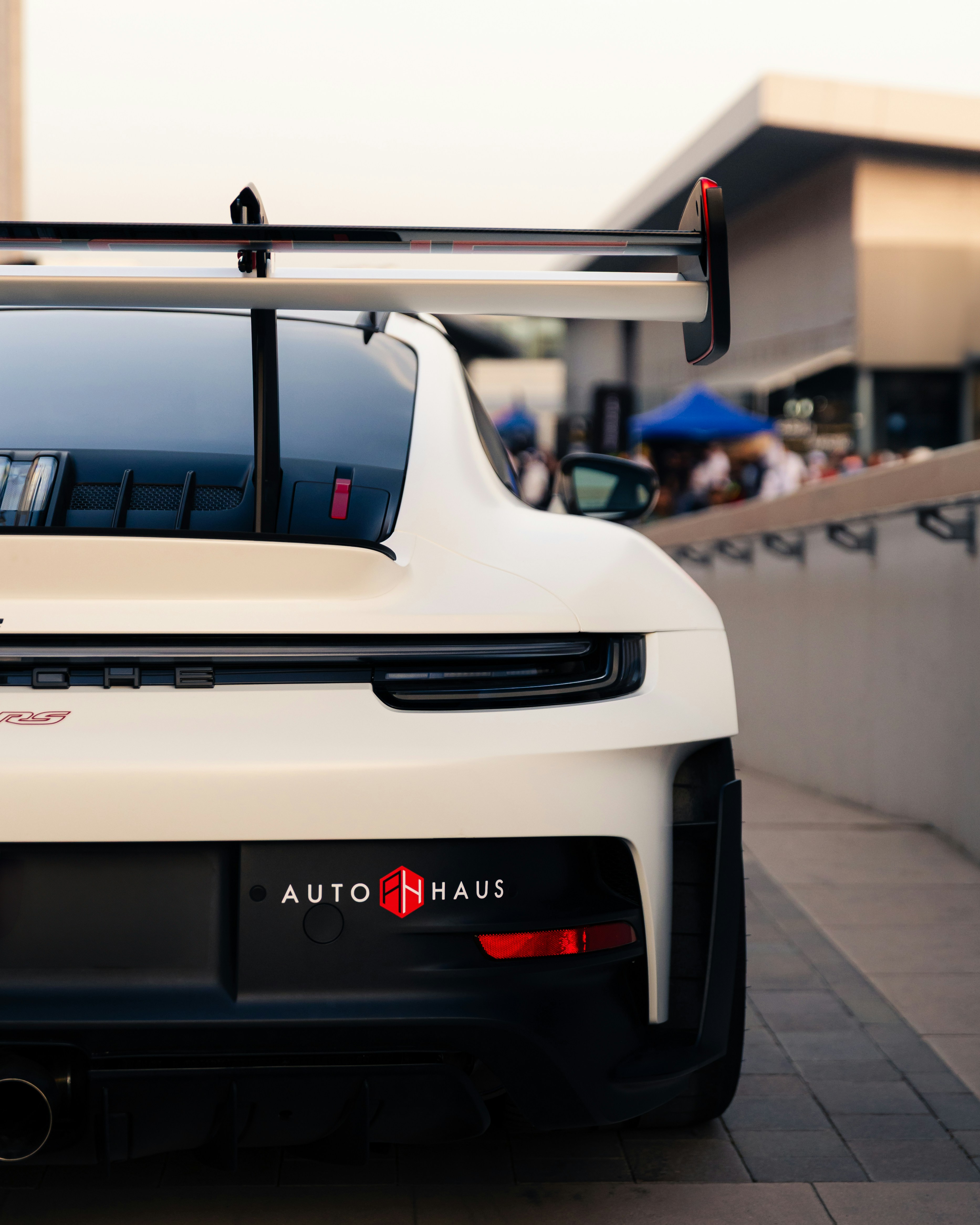White porsche with a large rear wing. photo – Free Vehicle Image on ...