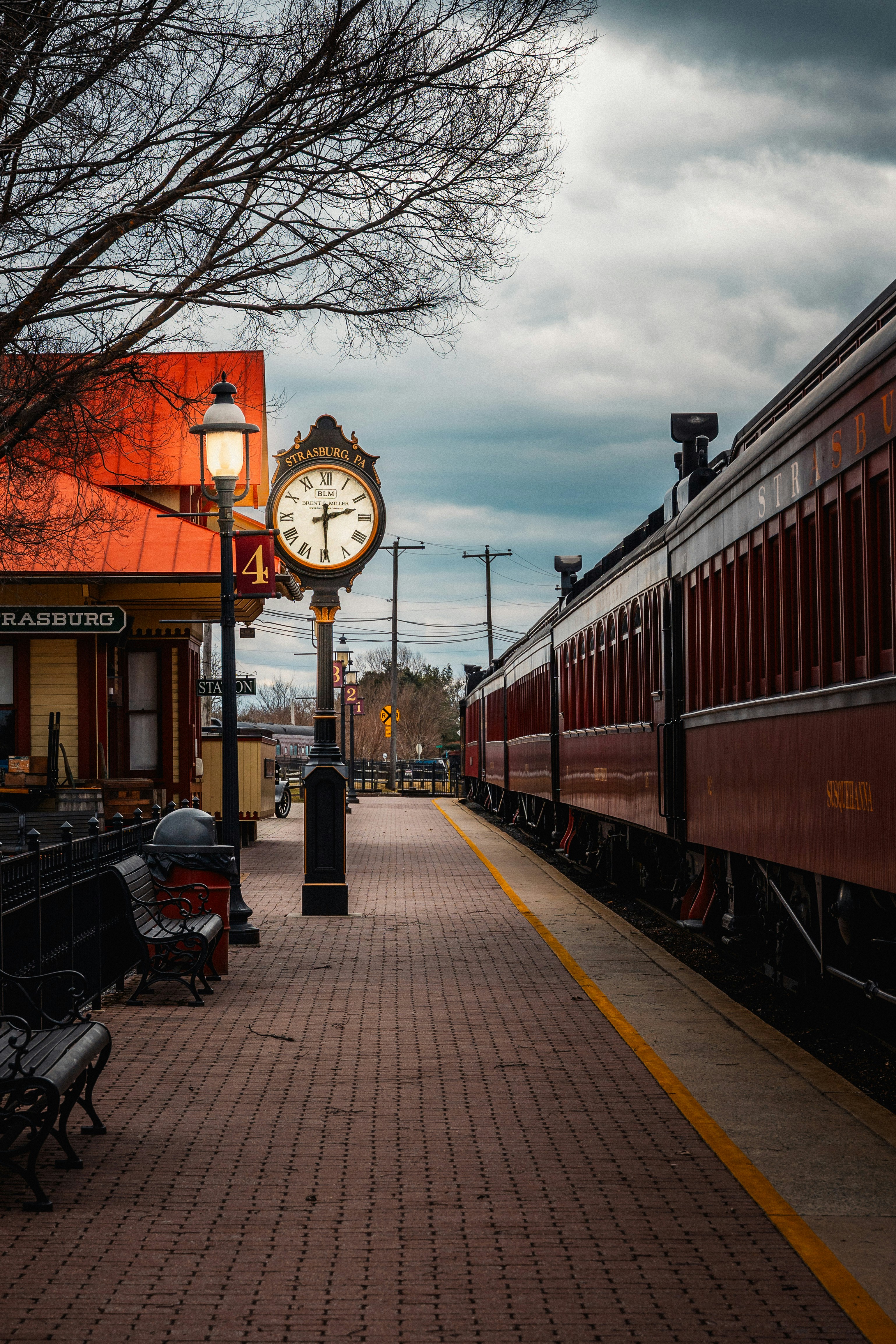 A train waits at a vintage station.