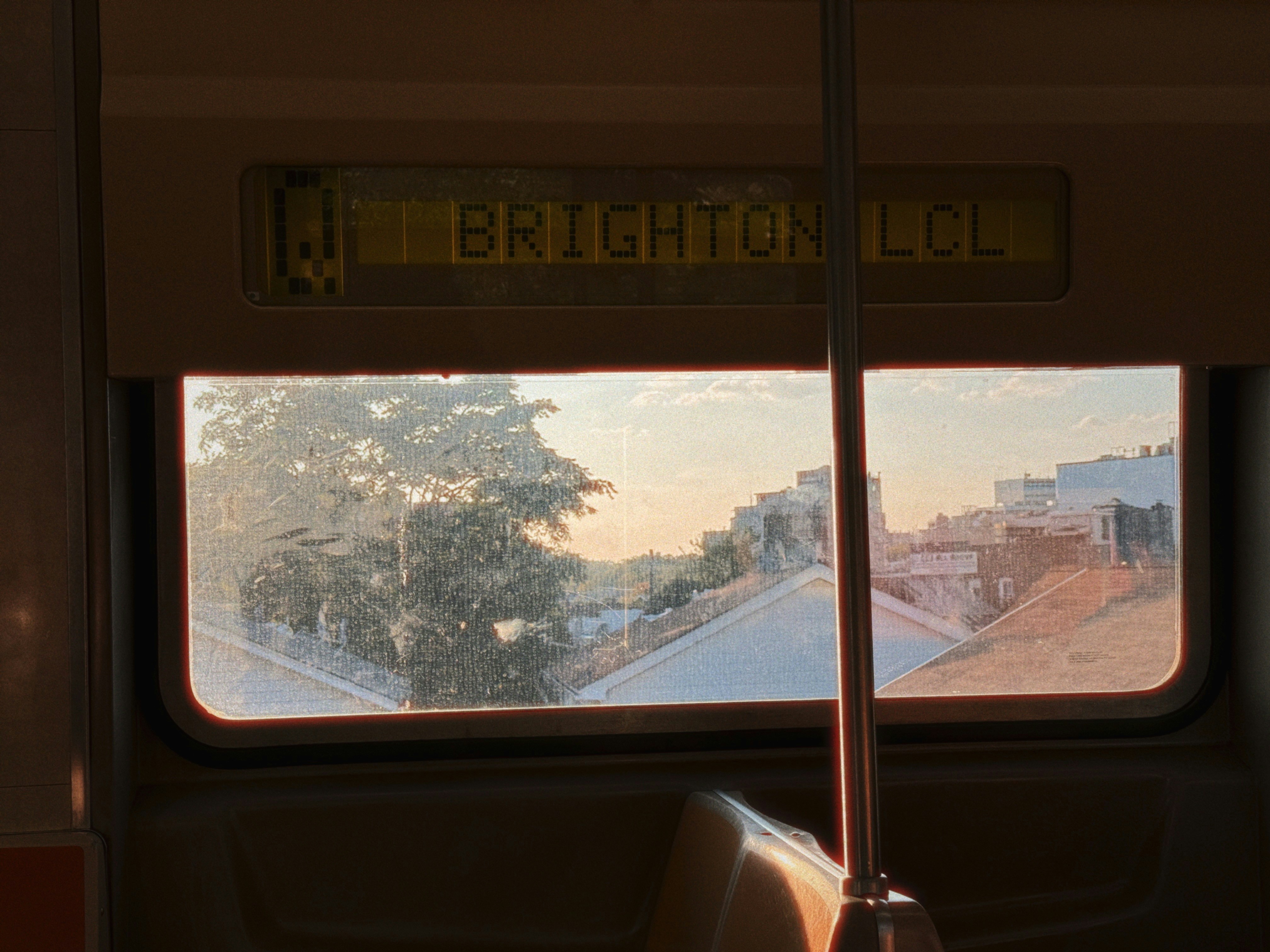 A train window view reading "brighton iuc."