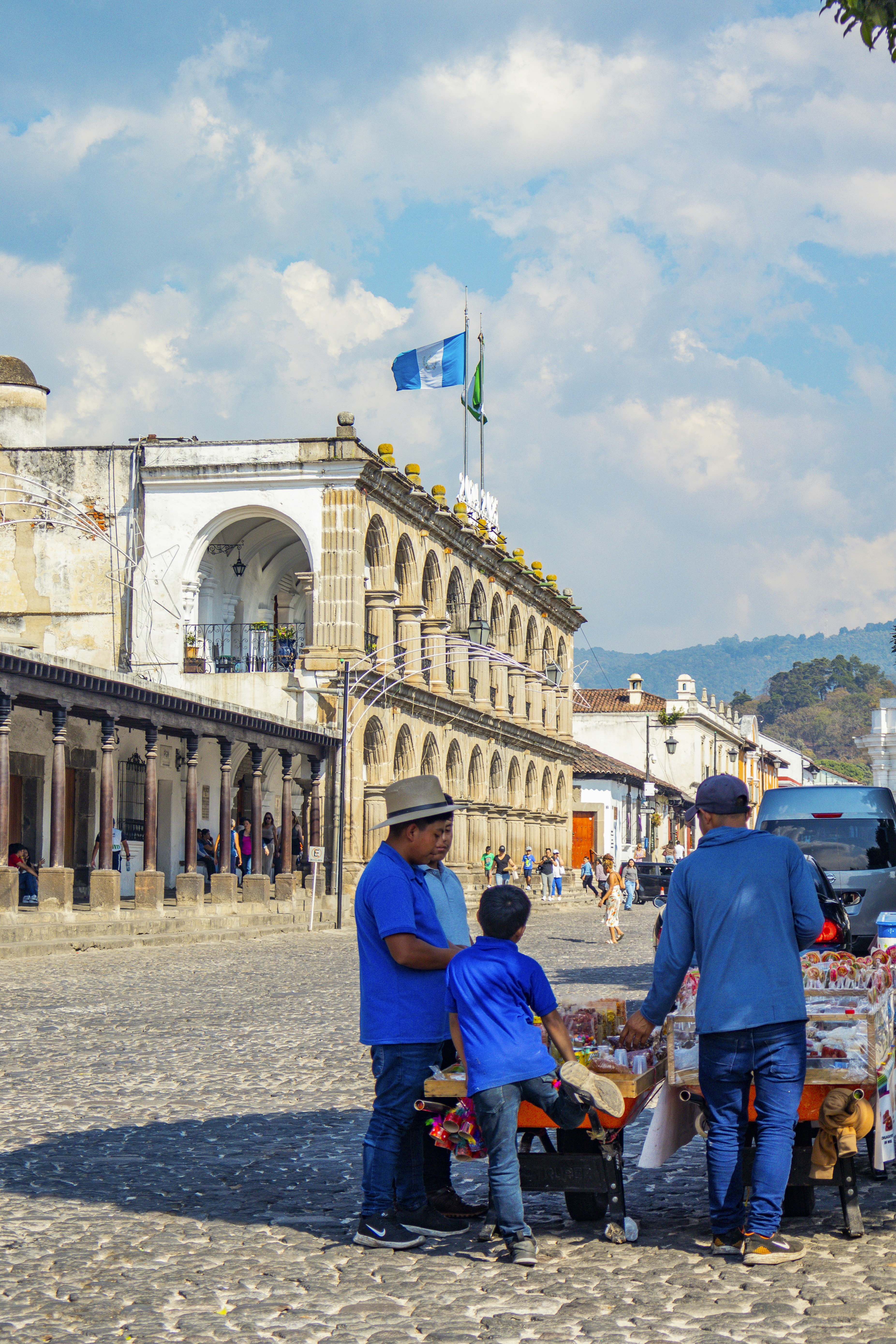 People shop from a street vendor in guatemala.