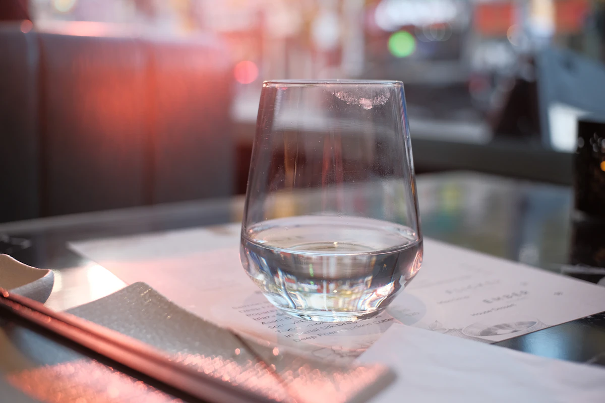 A glass of water on a restaurant table