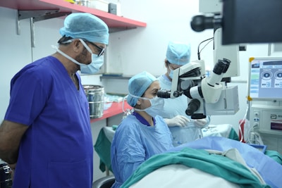 Doctors are performing surgery in an operating room.