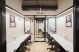 A modern, empty office space with desks.