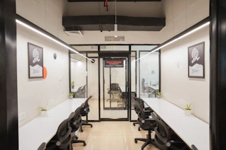 A modern, empty office space with desks.
