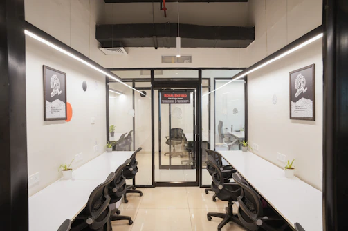 A modern, empty office space with desks.