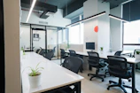Modern, open-plan office space with desks and chairs.