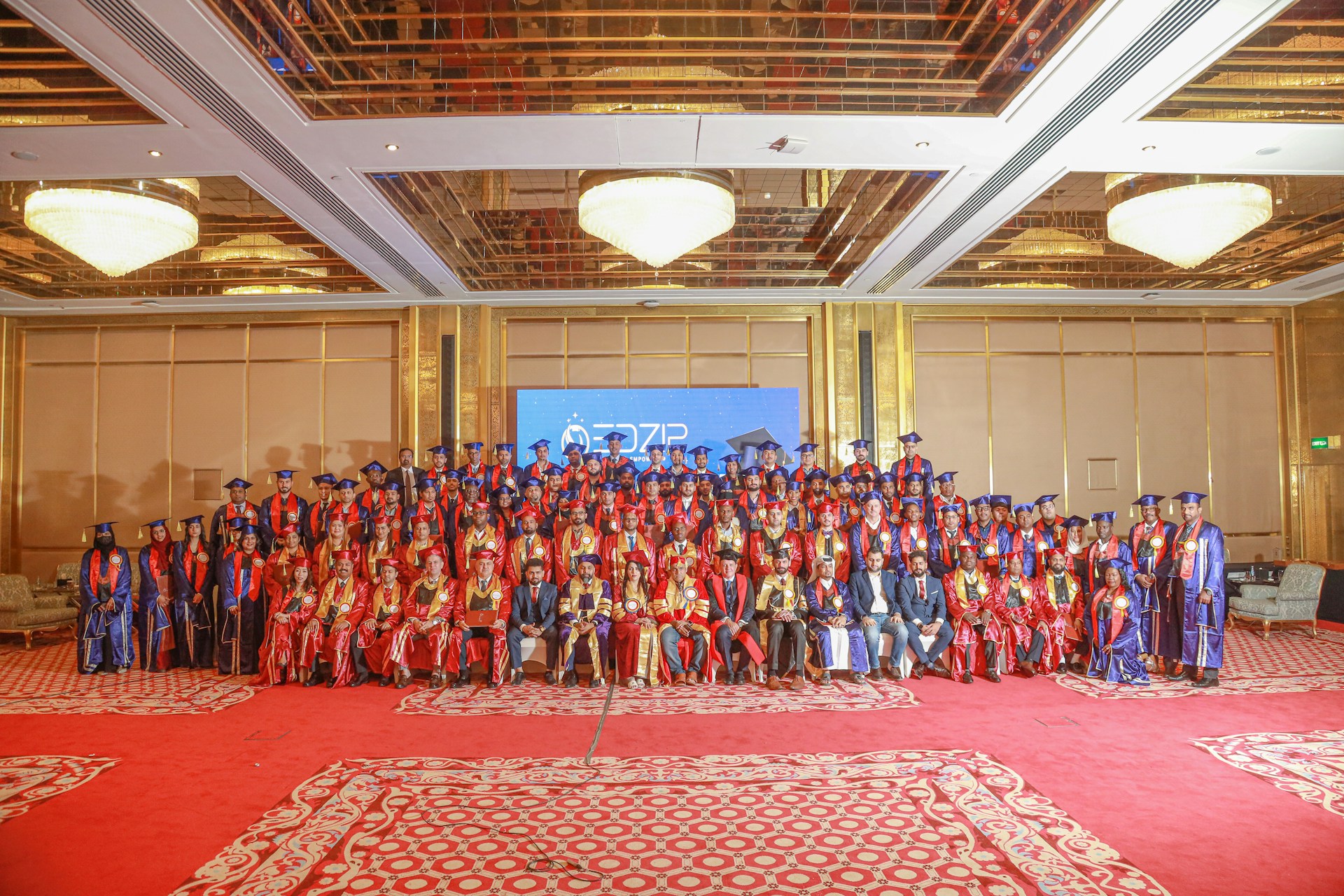 Graduation ceremony with many happy graduates.