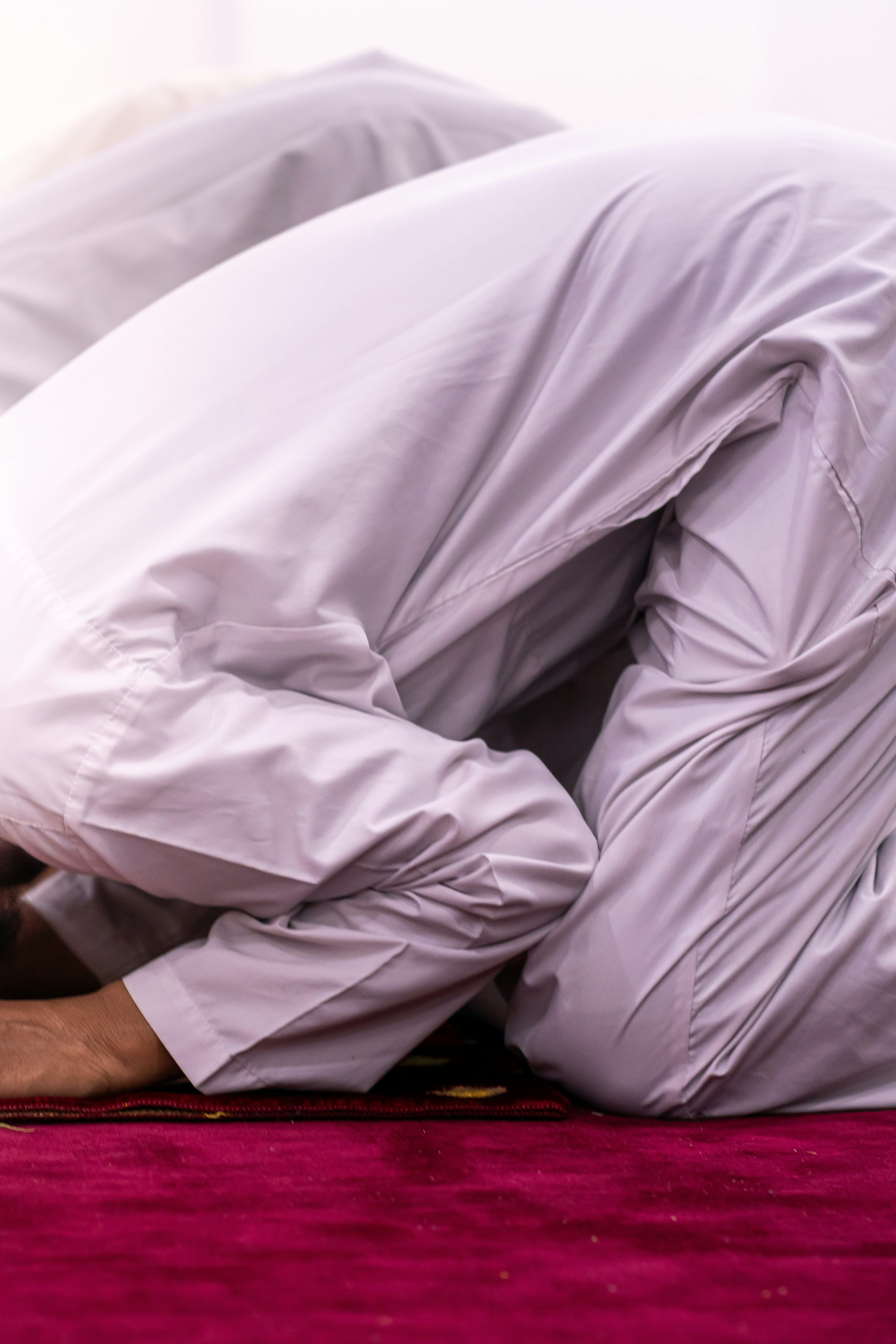 Men are praying in islamic rituals.