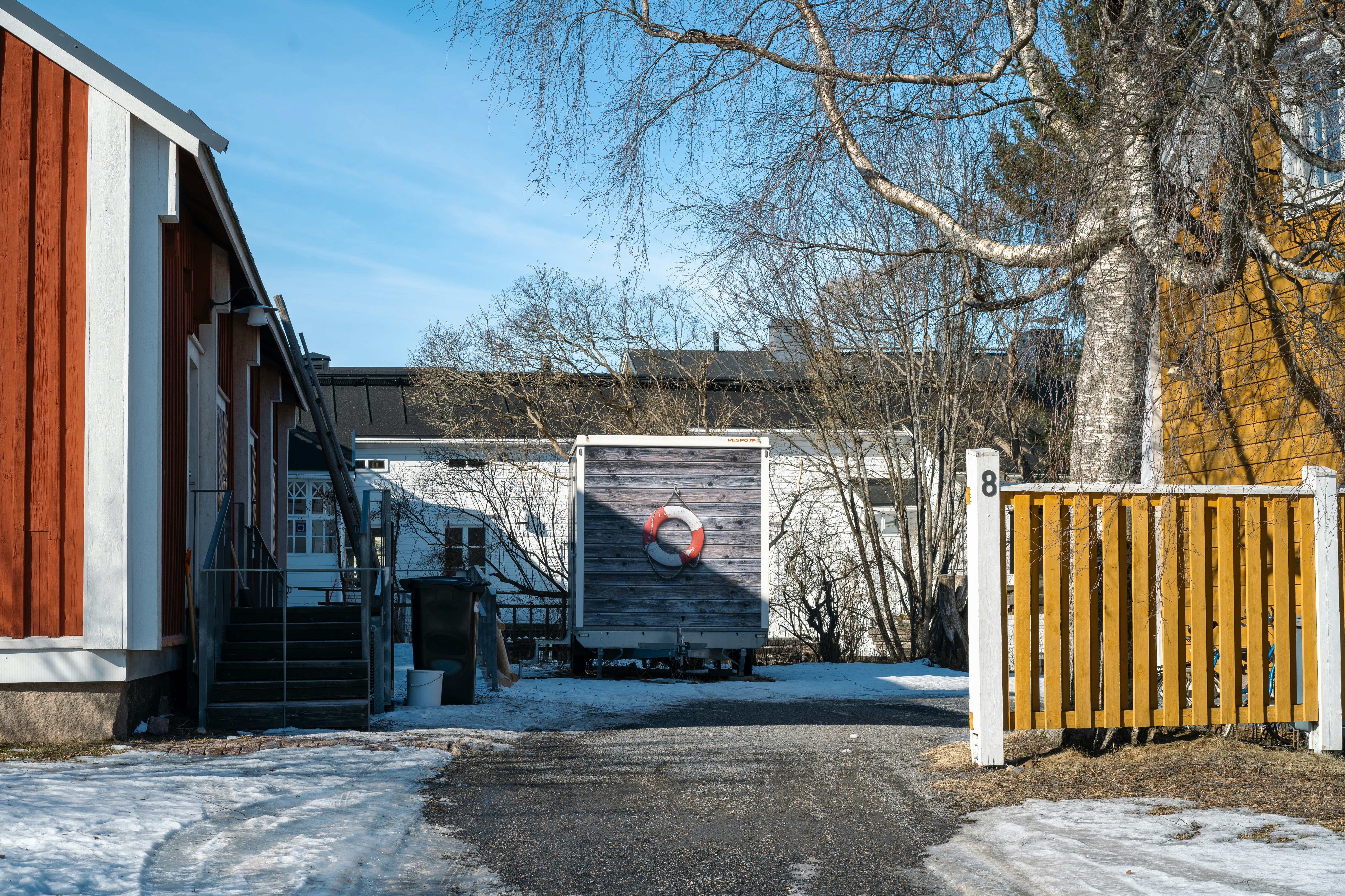 woman wearing yellow long-sleeved dress under white clouds and blue sky during daytime