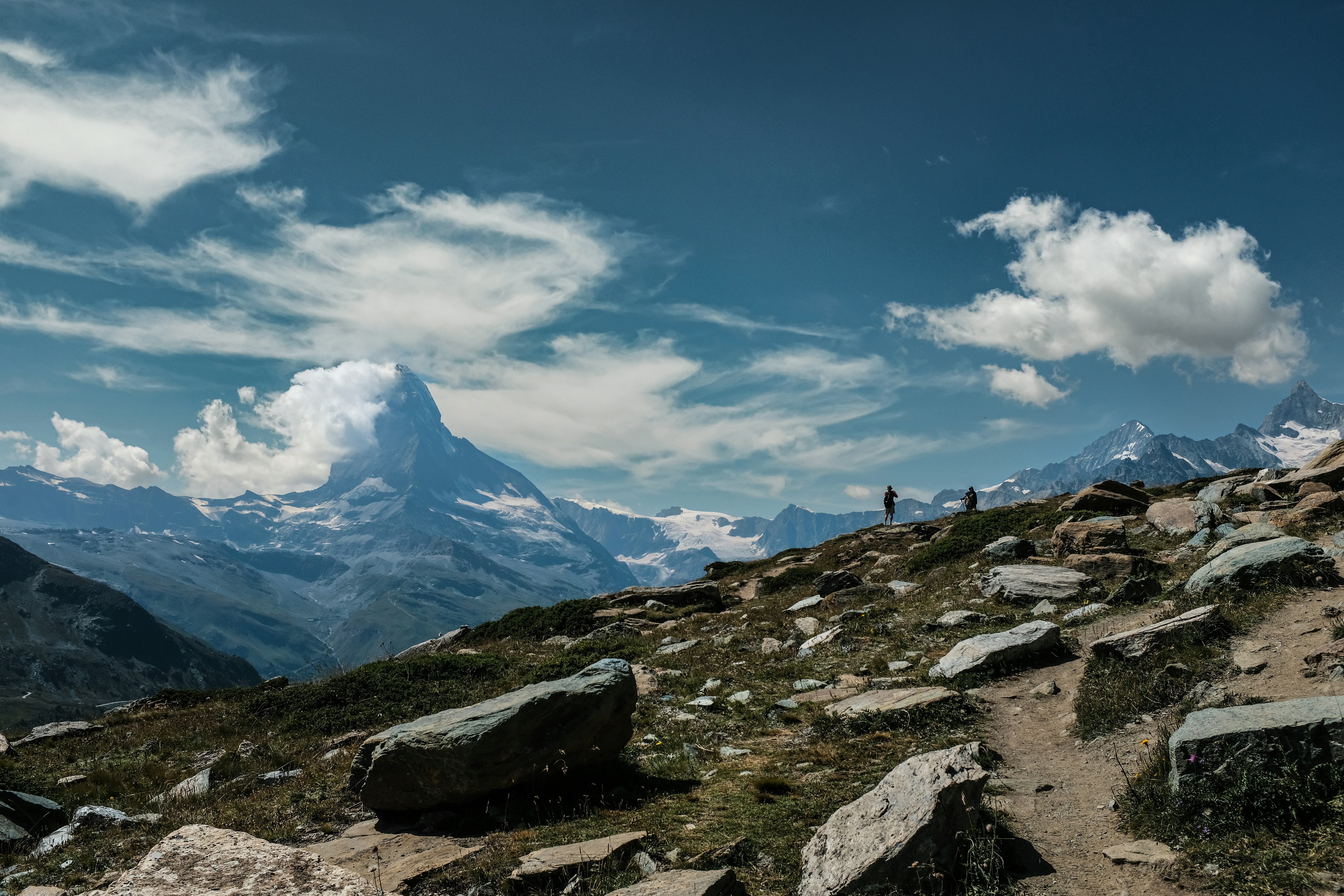 The Matterhorn looms majestically under a deep blue Alpine sky