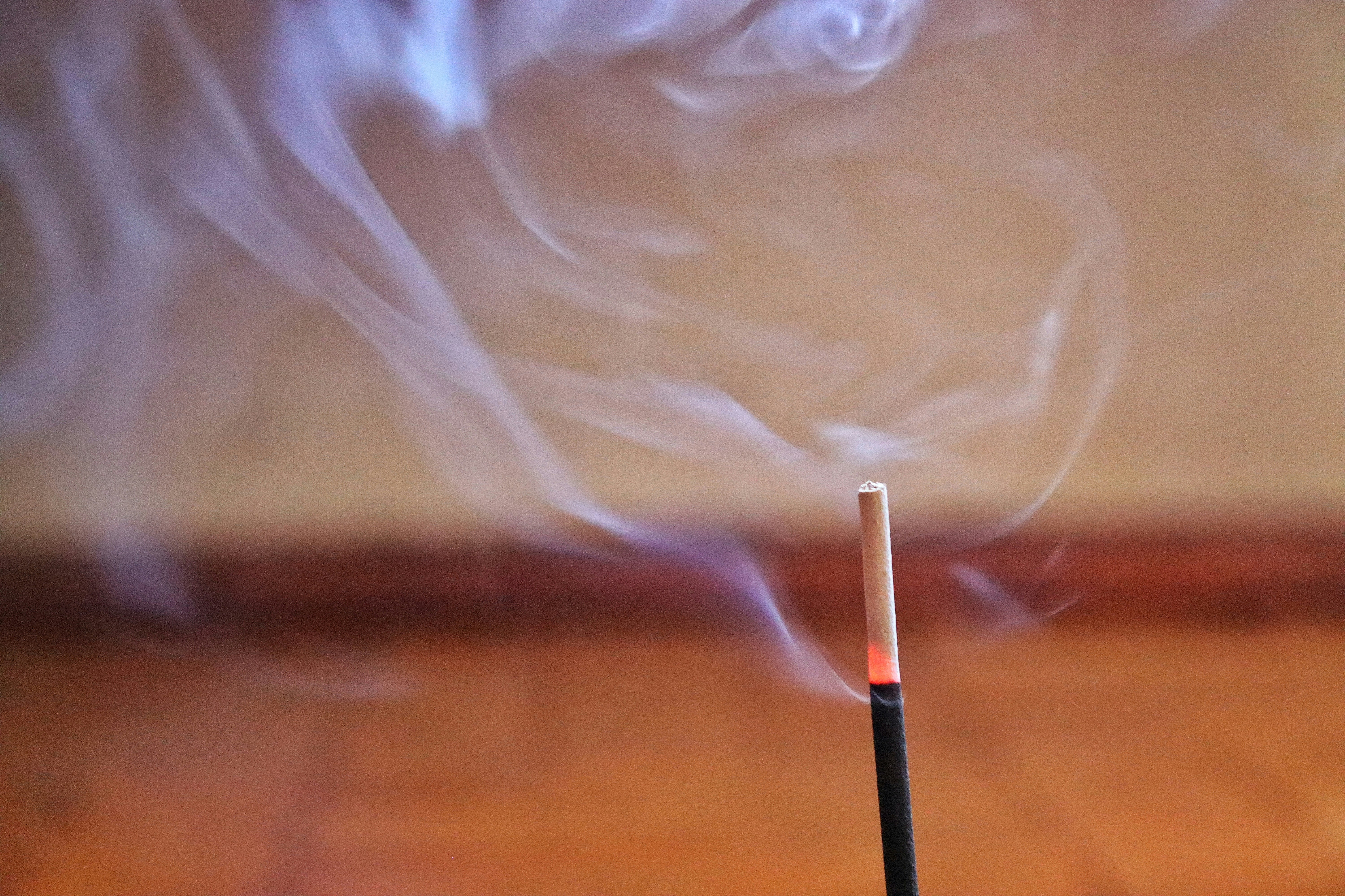 Incense sticks with gentle smoke – a calm, ritualistic atmosphere