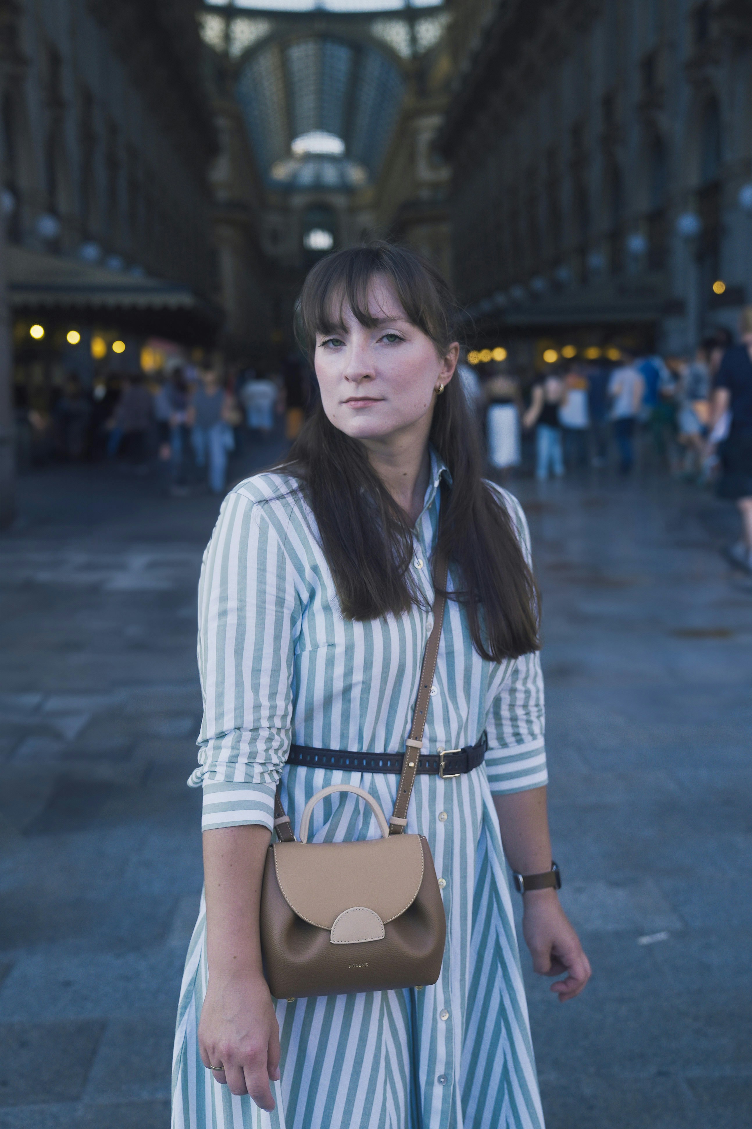 Woman posing in a beautiful european plaza.