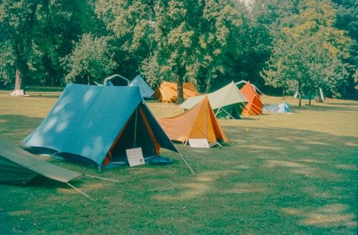 A campsite with many colorful tents is seen.