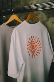 T-shirts hang on a rack.