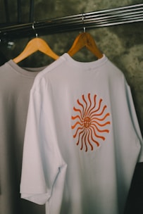 T-shirts hang on a rack.
