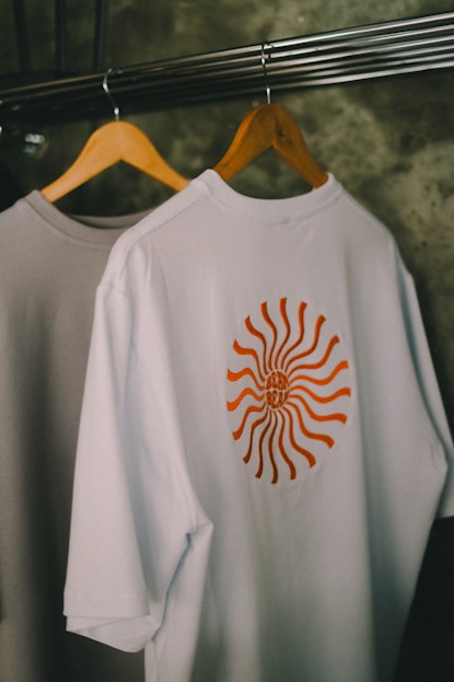 T-shirts hang on a rack.