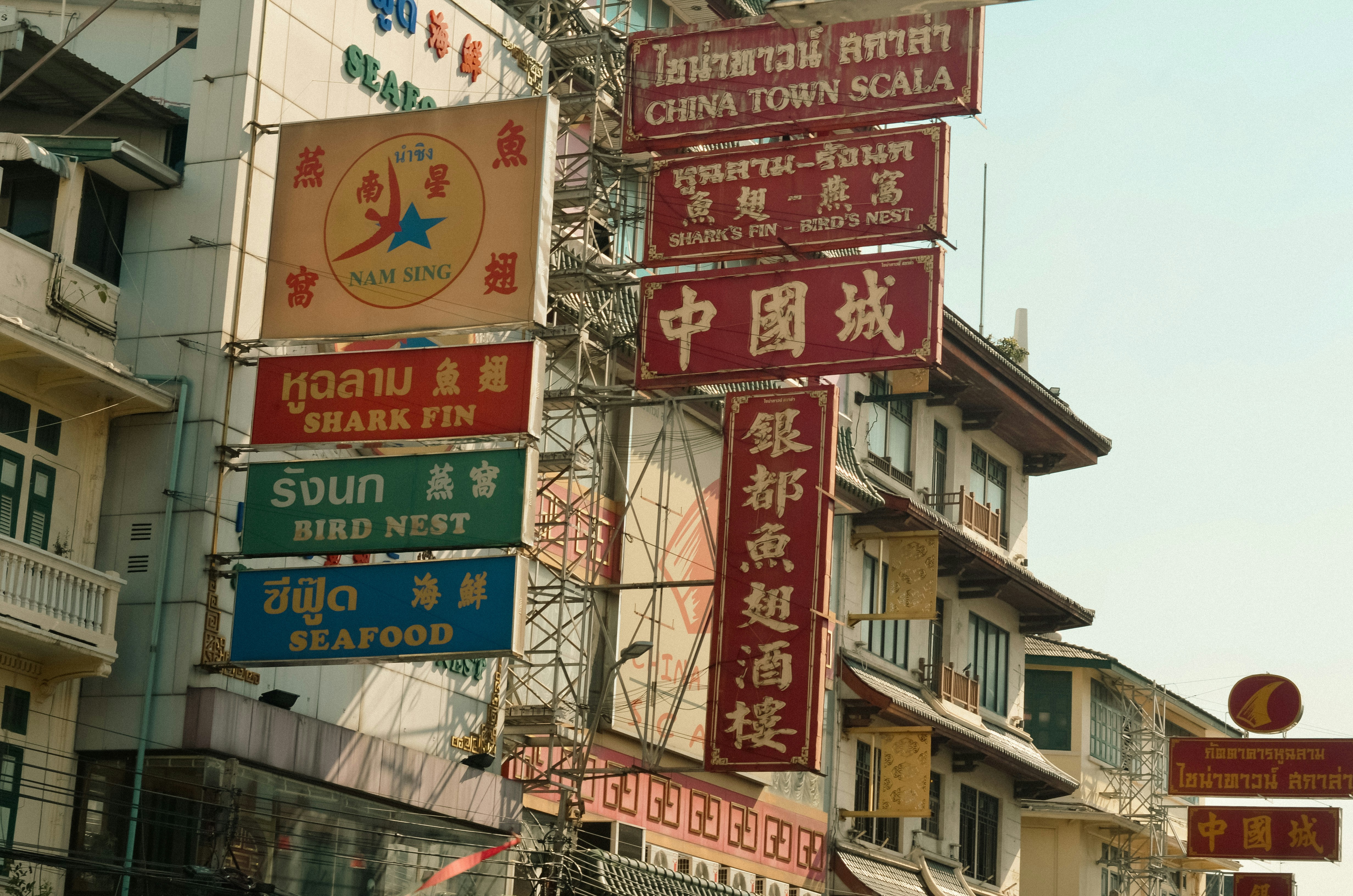Signboards in chinatown showcasing various restaurants.
