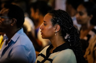 A woman looks on during a gathering.