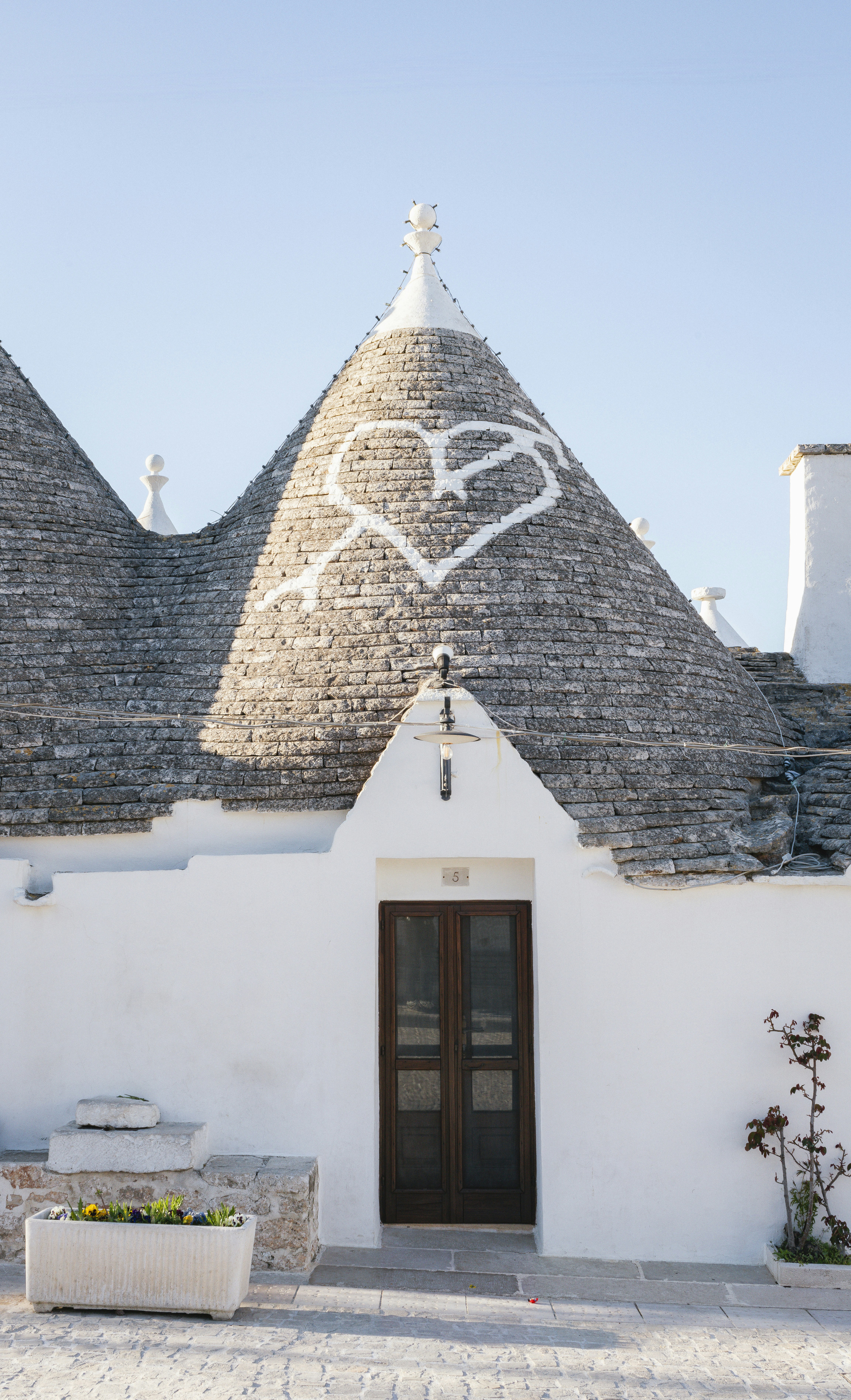 Traditional italian building with heart on the roof. photo – Free Bari ...