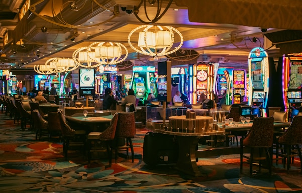 A casino interior with slots and tables is shown.