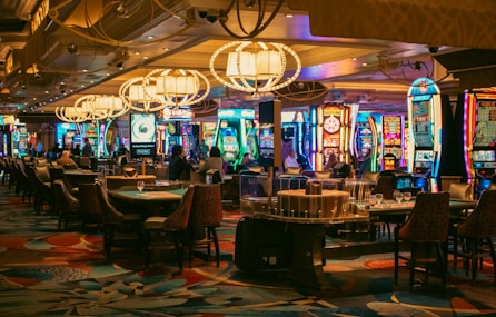 A casino interior with slots and tables is shown.