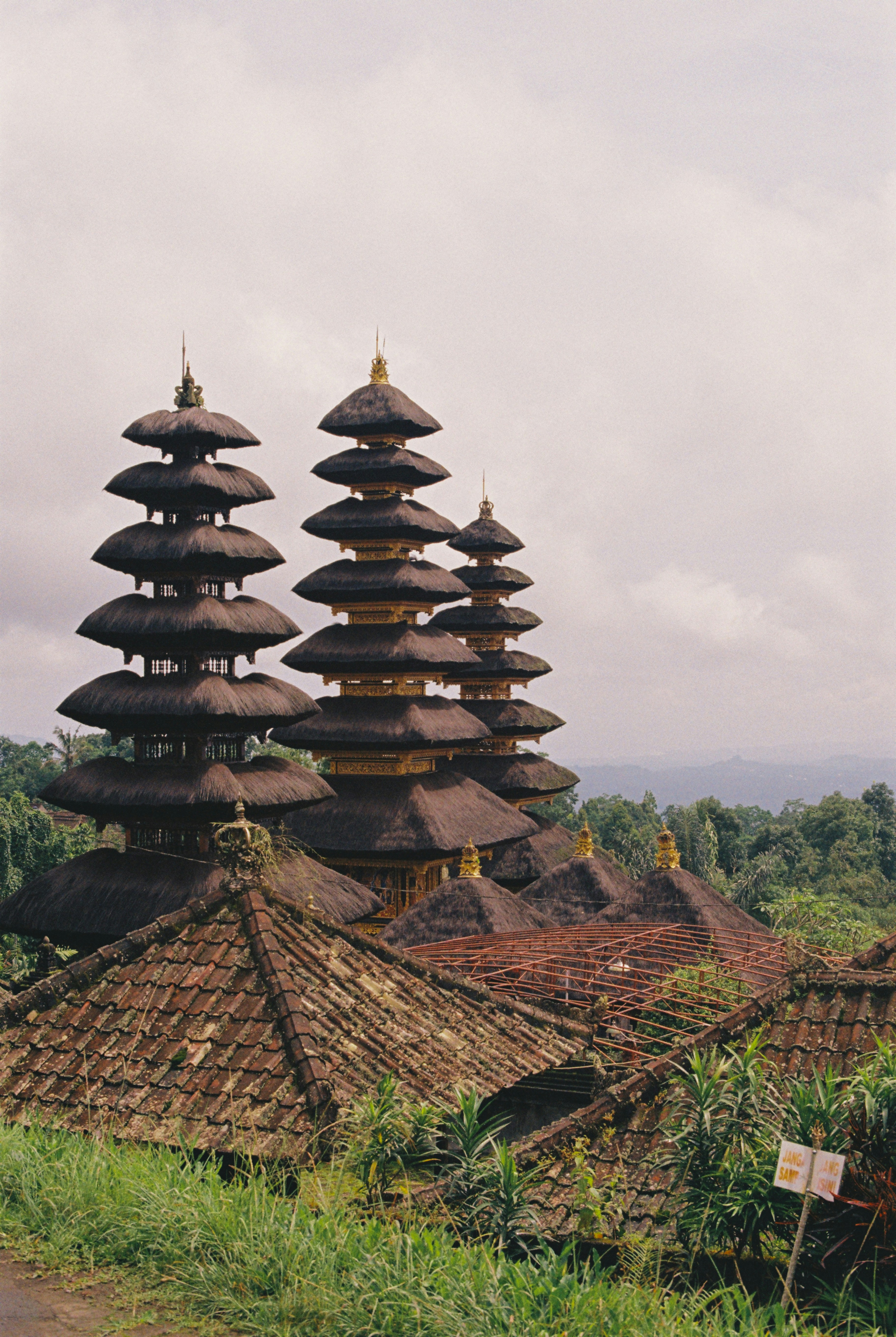 Temple complex with tiered roofs against a sky.