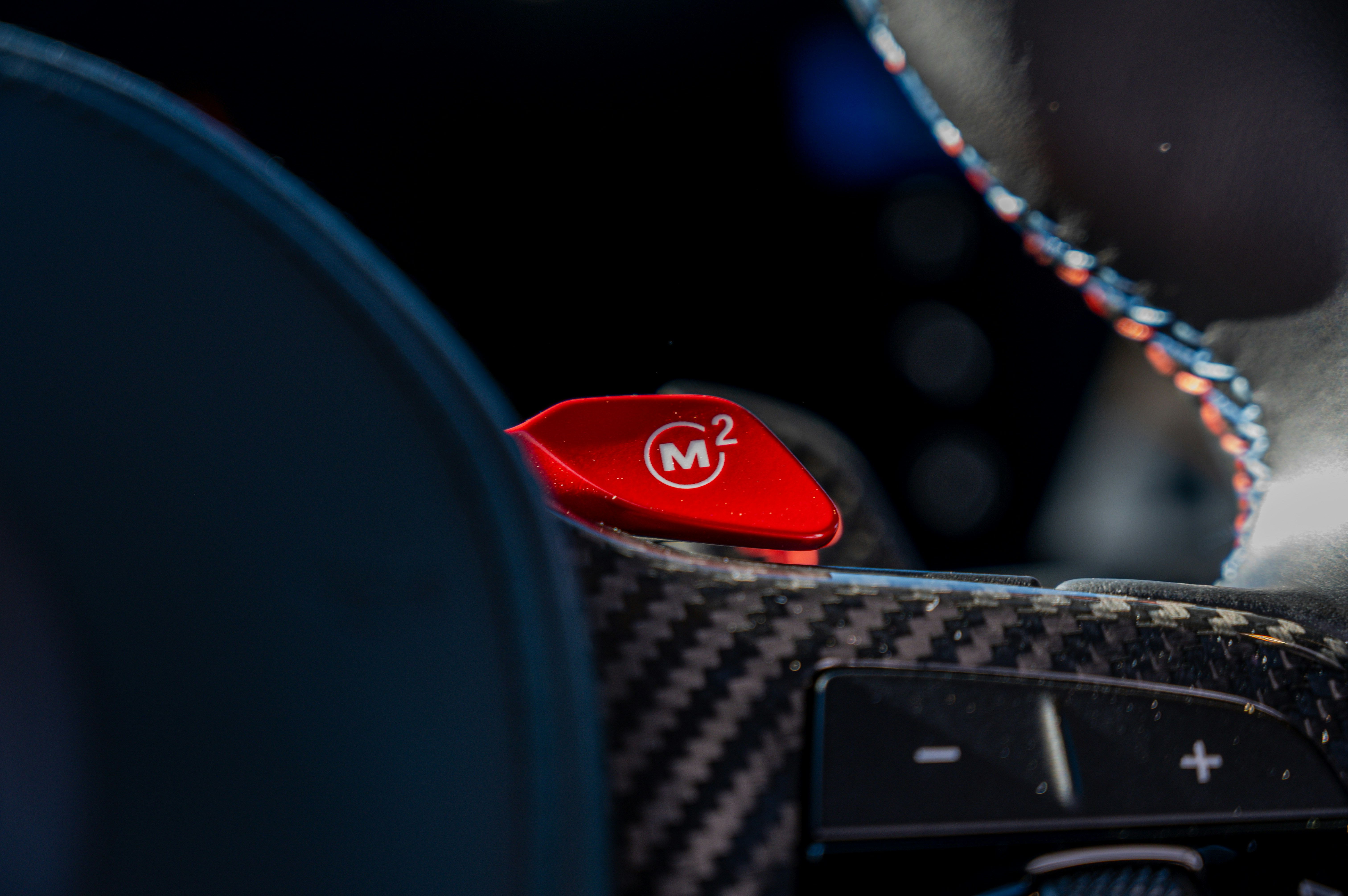 The image shows an m2 performance button.