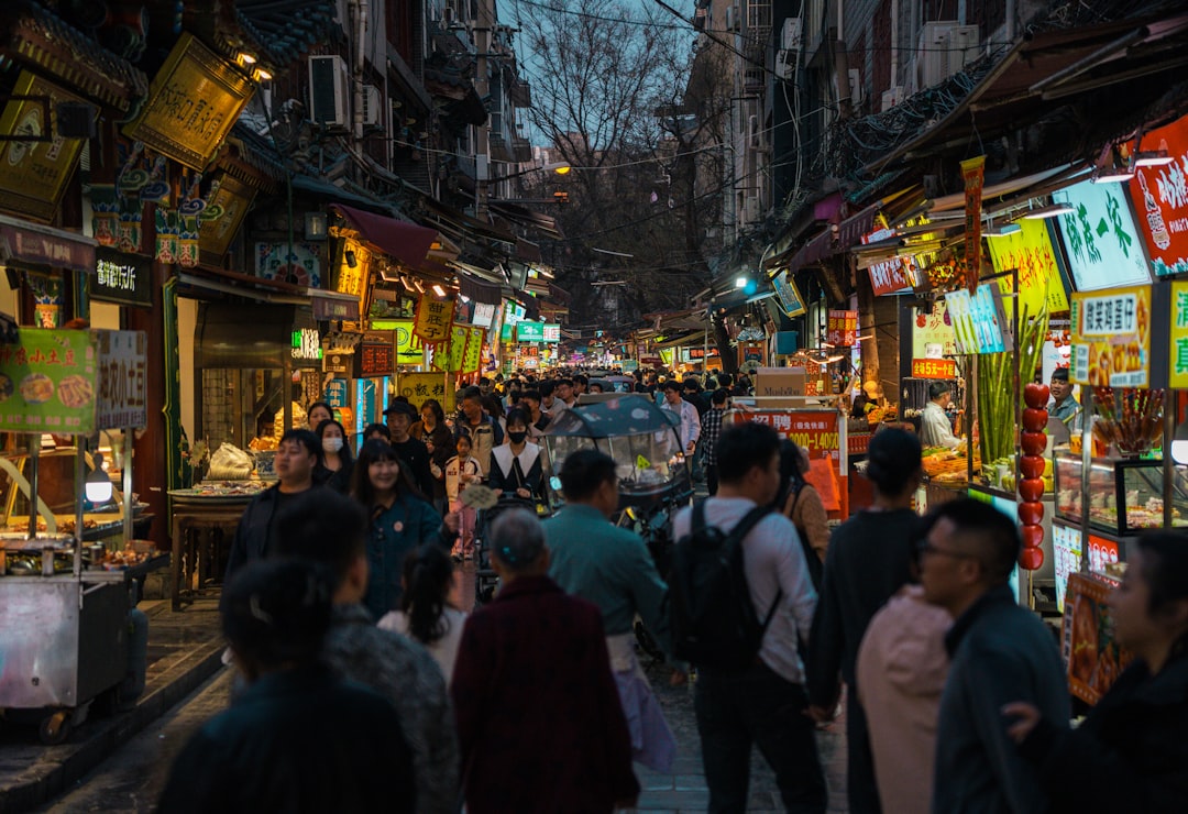 Street food market in the streets of Xi'an, China, showing social atmosphere
