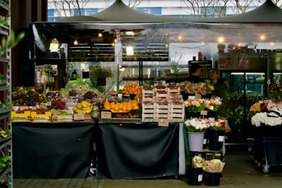 A bustling flower and fruit stand.
