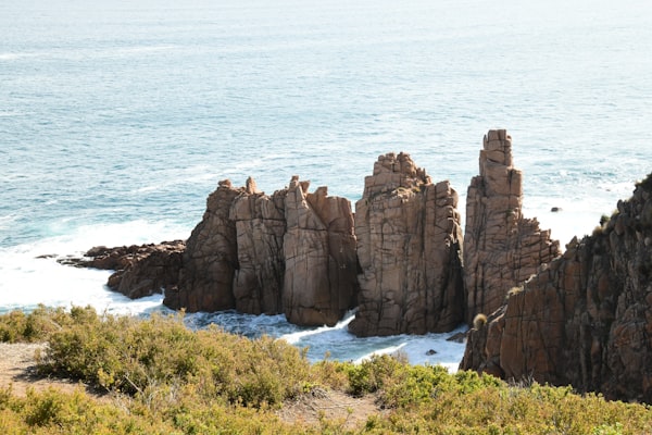 Jagged rock formations beside the wild ocean along the Victorian coastline