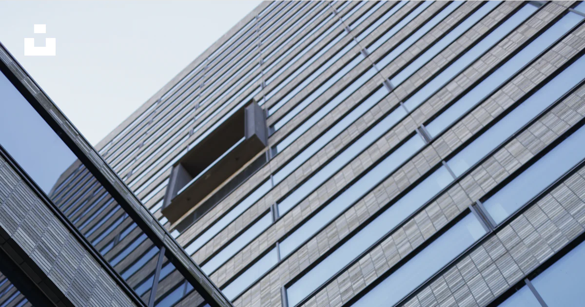 Modern building's sharp angles and reflective windows. photo – Free ...