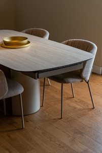 Dining table and chairs create a modern interior.