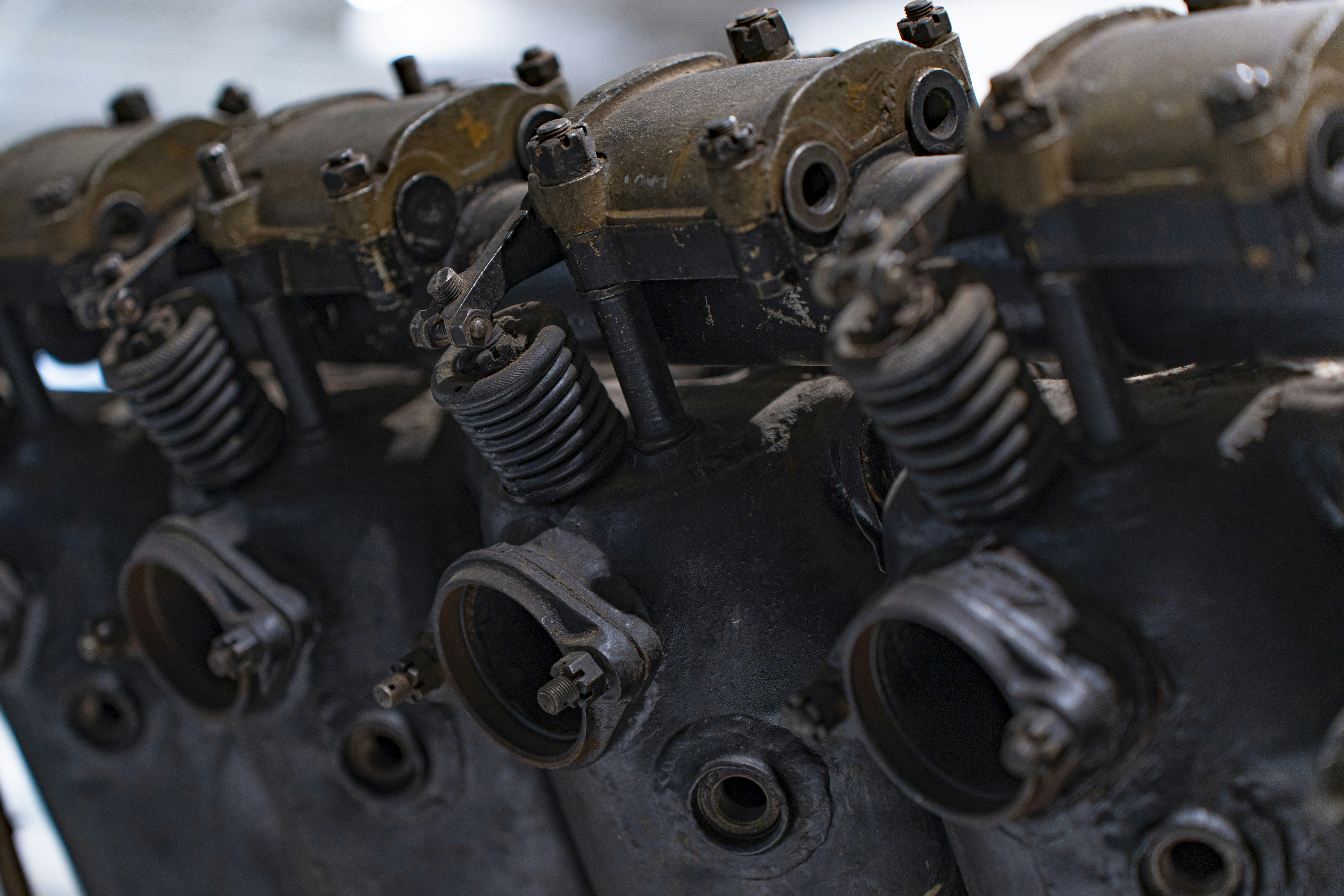 car engine cylinders close up with spark plug ignition coils visible
