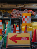 Road construction equipment and supplies are shown.