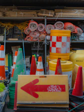 Road construction equipment and supplies are shown.