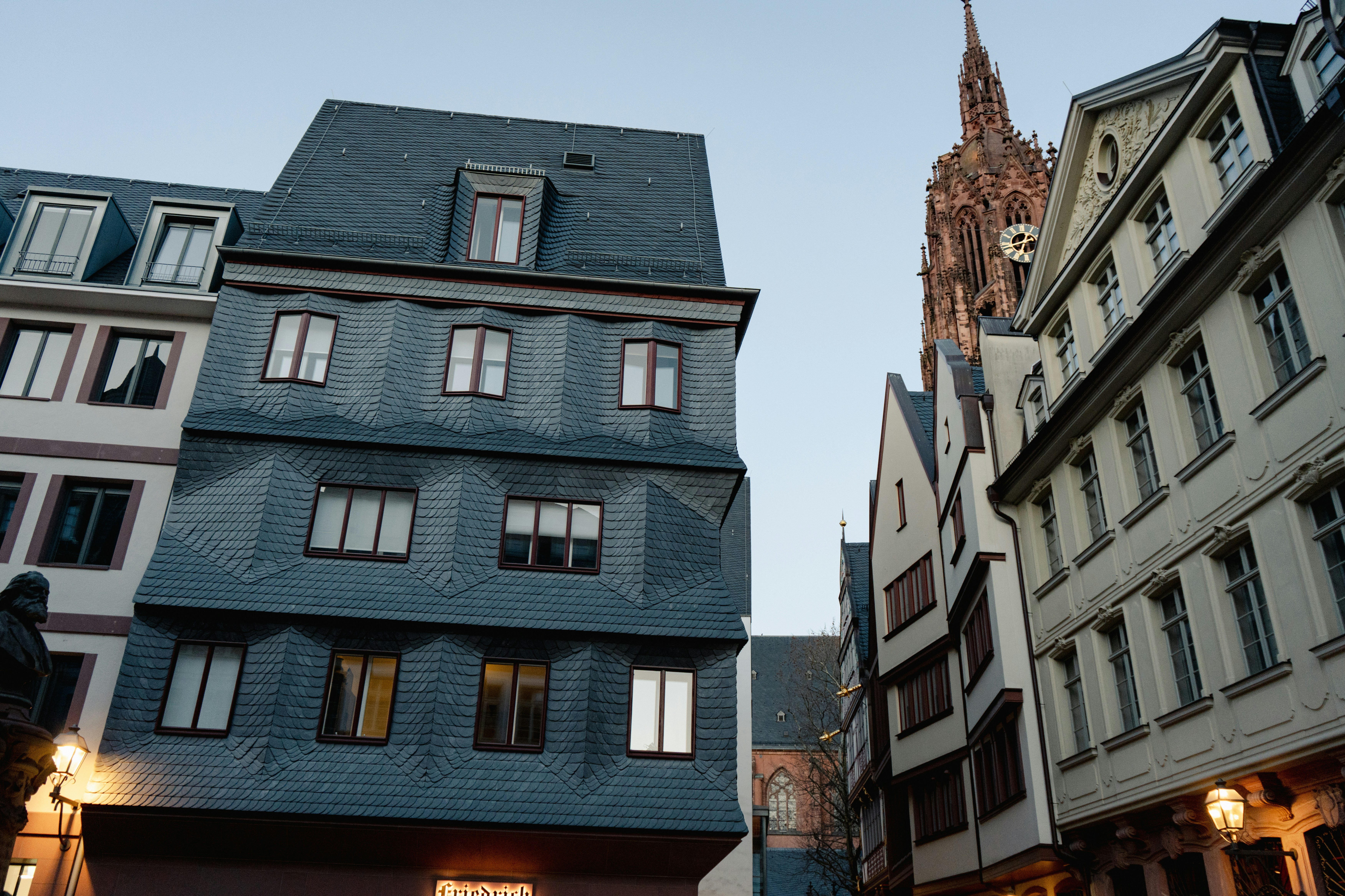 Buildings and a cathedral tower in an urban setting.