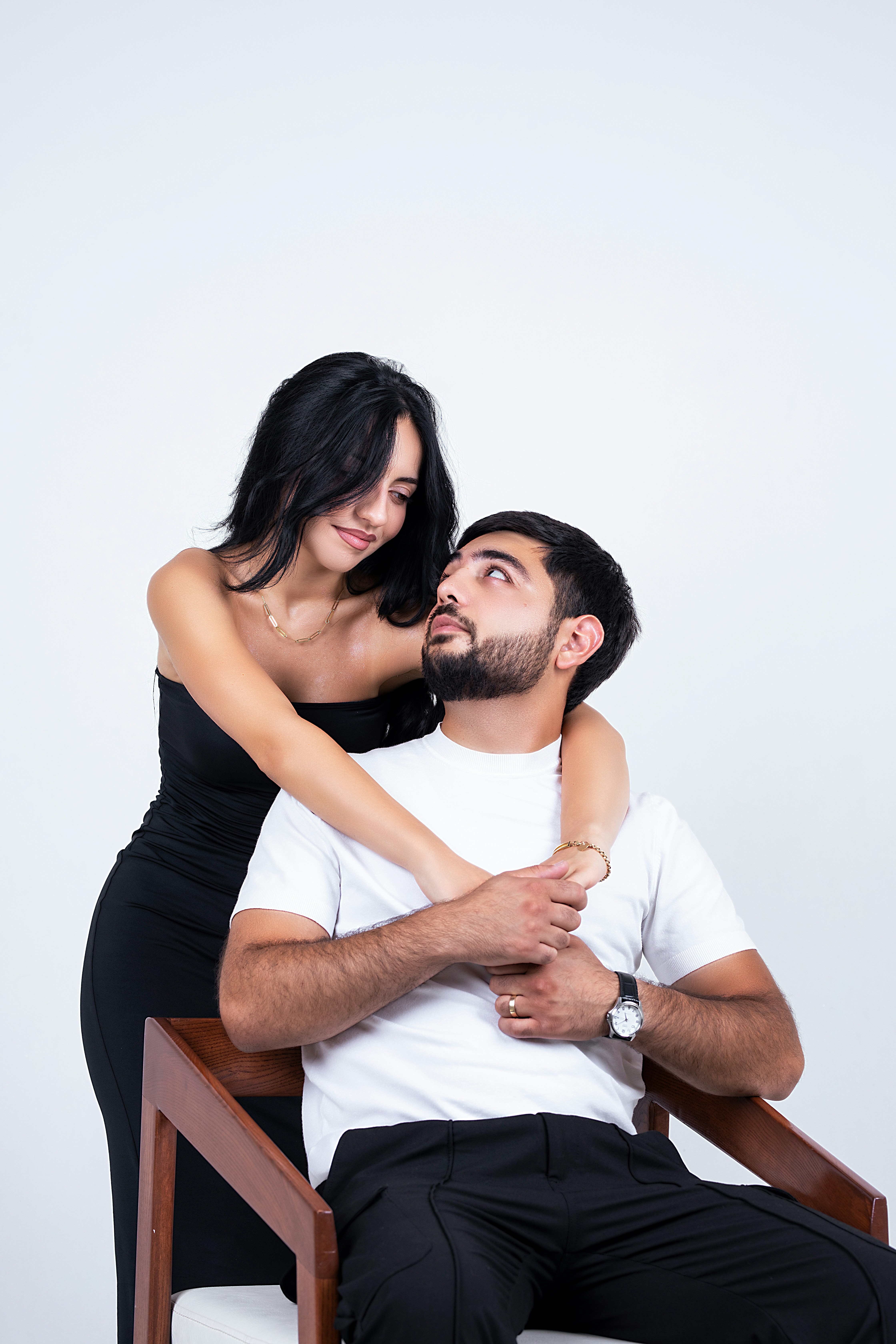 A couple looks lovingly at each other.