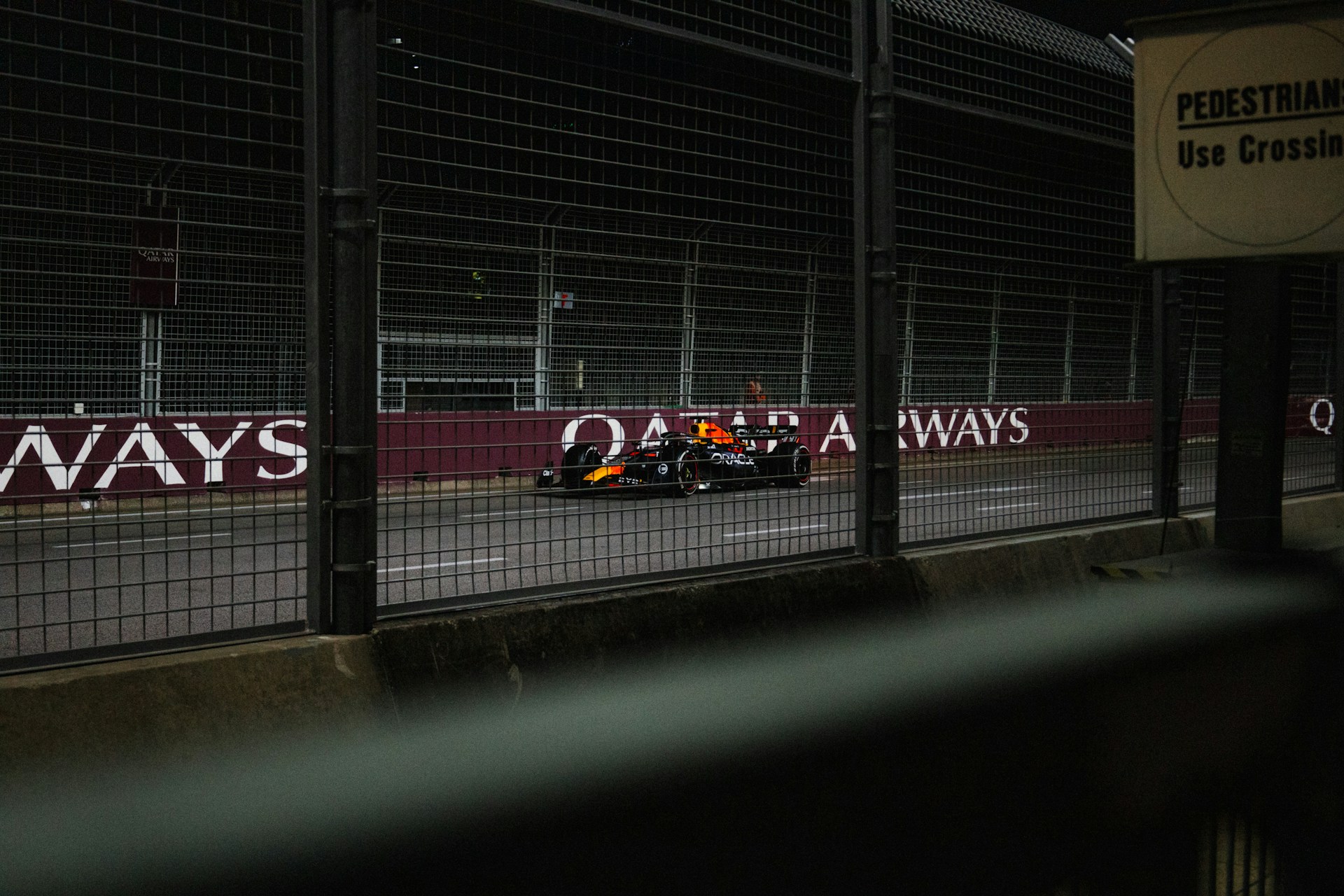 A race car is driving on the track.