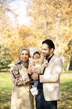 A family poses for a photo in the autumn.