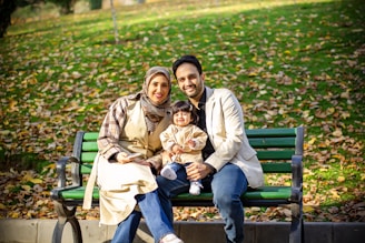 A happy family poses for a photo.